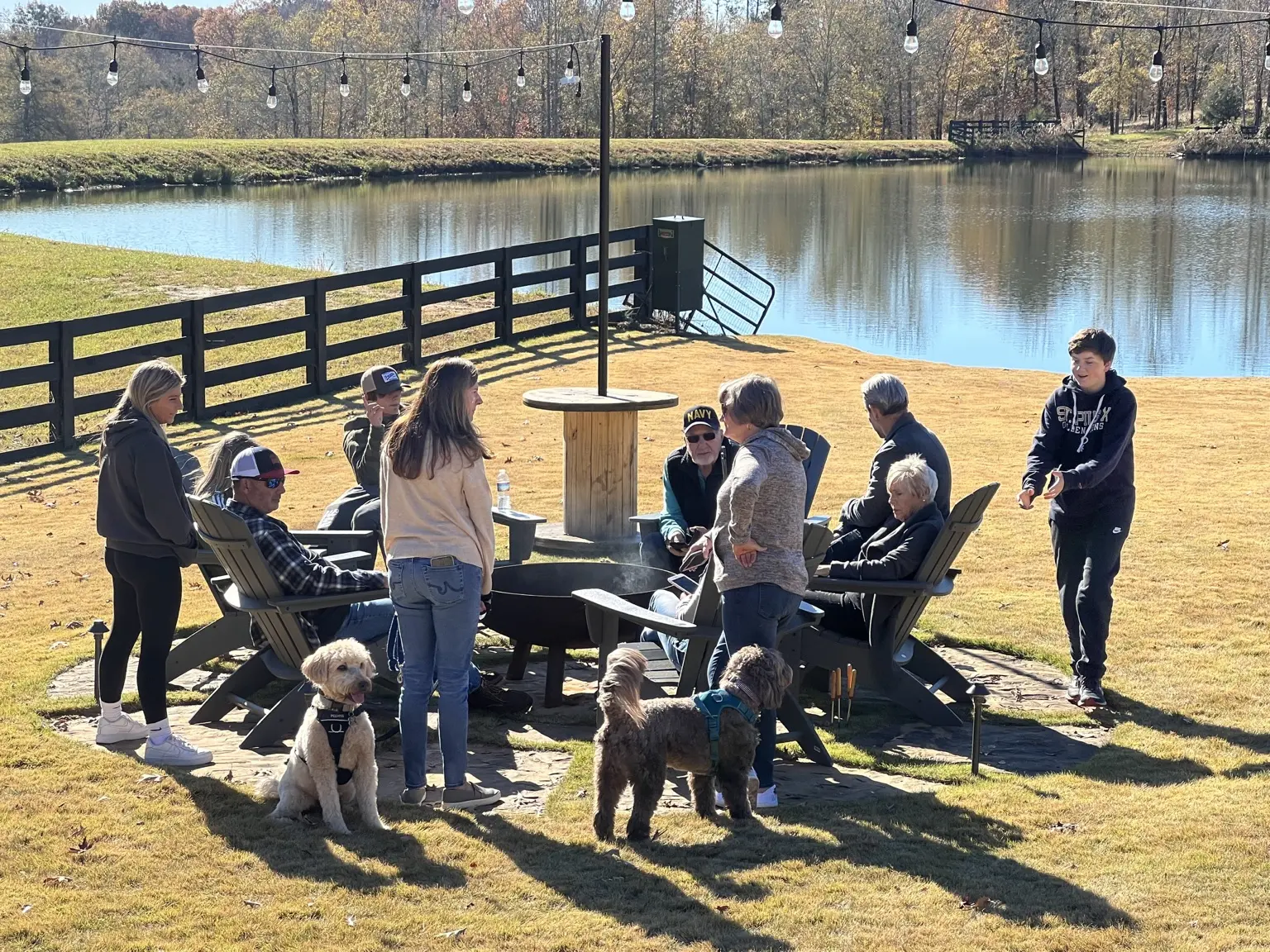 Guests gathered beside the lake at Twenty 20 Farms